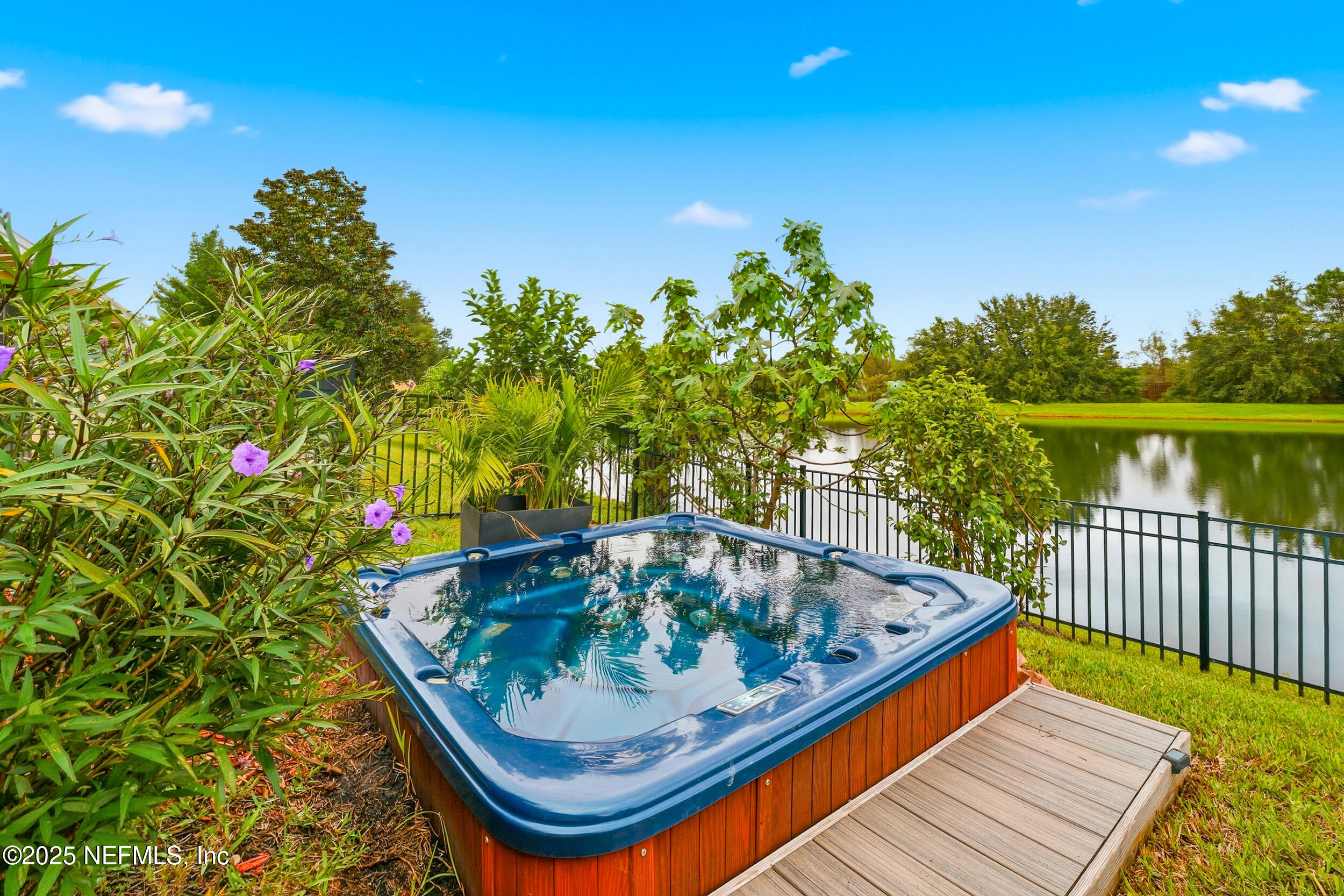 5877 Wind Cave Lane Jacksonville, FL 32258 - Photo 26 of 44 a small pool with trees in the background