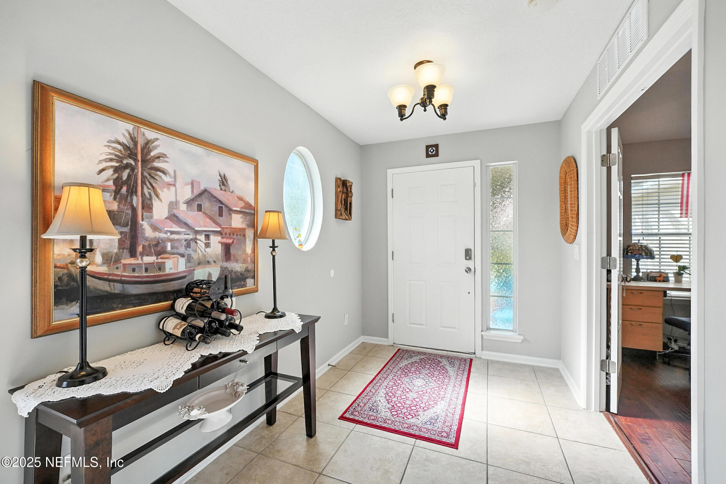 5877 Wind Cave Lane Jacksonville, FL 32258 - Photo 3 of 44 a view of a room with gym equipment