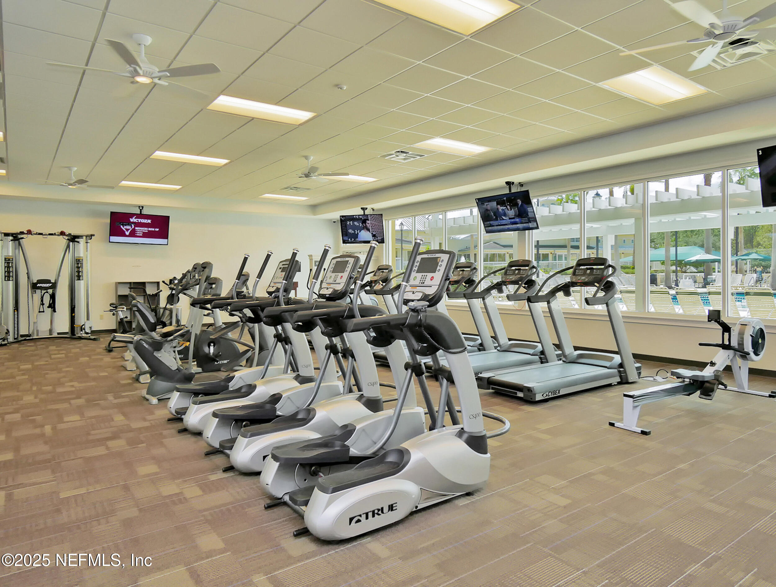 5877 Wind Cave Lane Jacksonville, FL 32258 - Photo 42 of 44 a view of a room with gym equipment