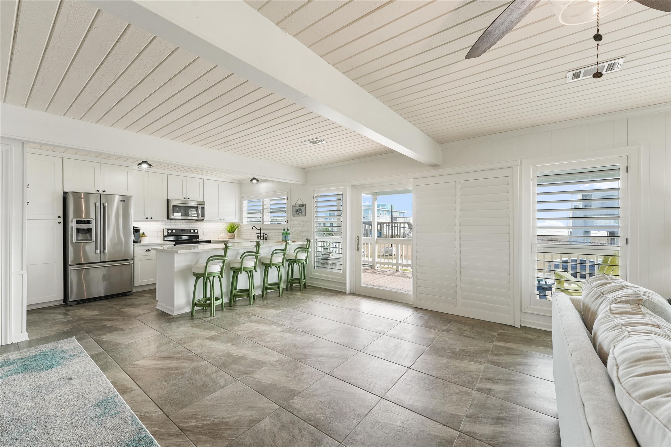 16634 Jamaica Beach Road Galveston, TX 77554 - Photo 14 of 47 a view of a kitchen with furniture and window