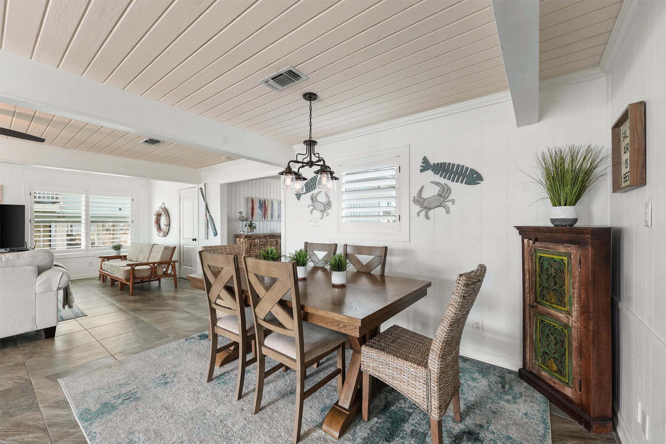 16634 Jamaica Beach Road Galveston, TX 77554 - Photo 16 of 47 a view of a dining room with furniture