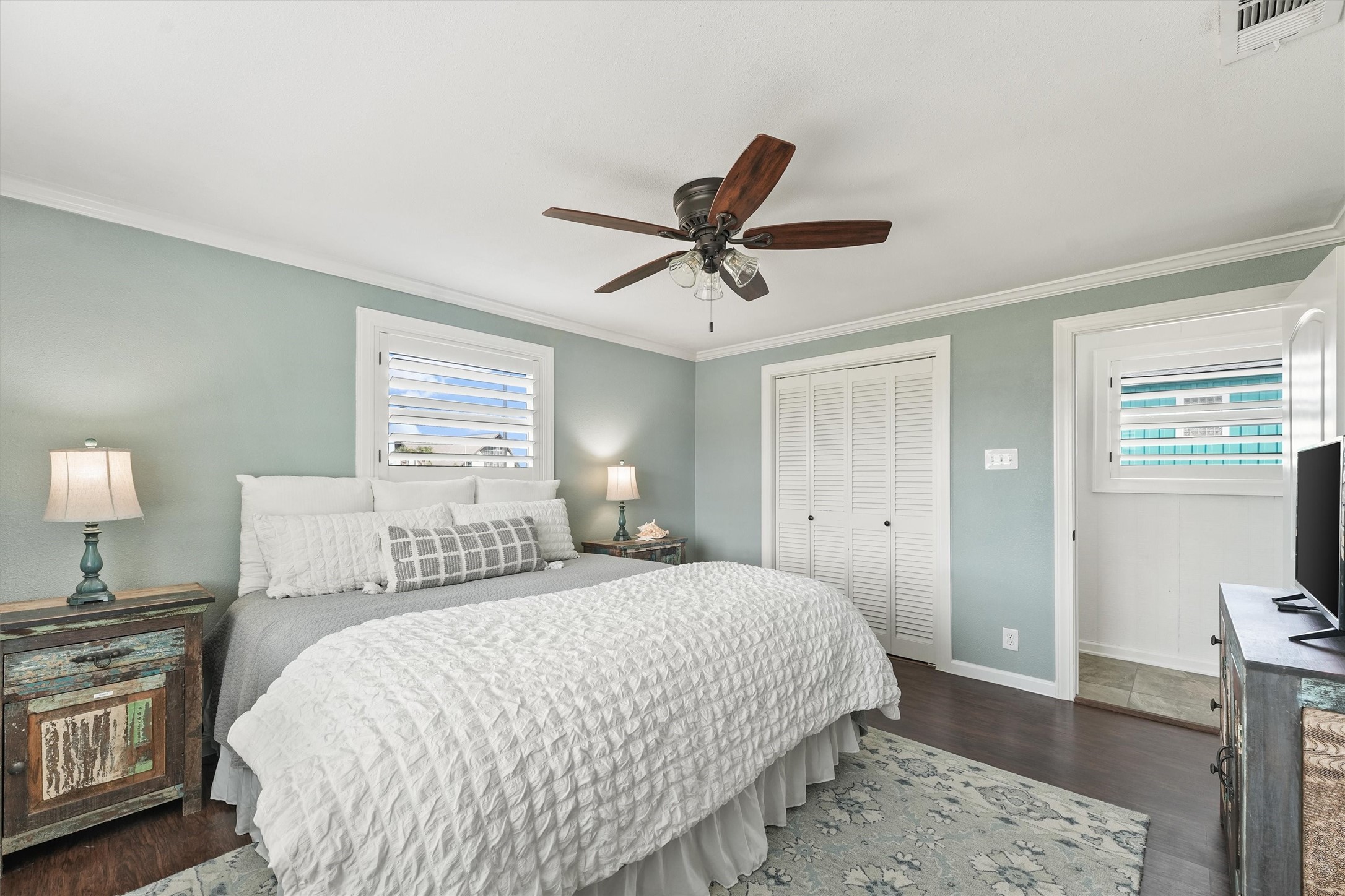 16634 Jamaica Beach Road Galveston, TX 77554 - Photo 18 of 47 a bedroom with a bed and wooden floor