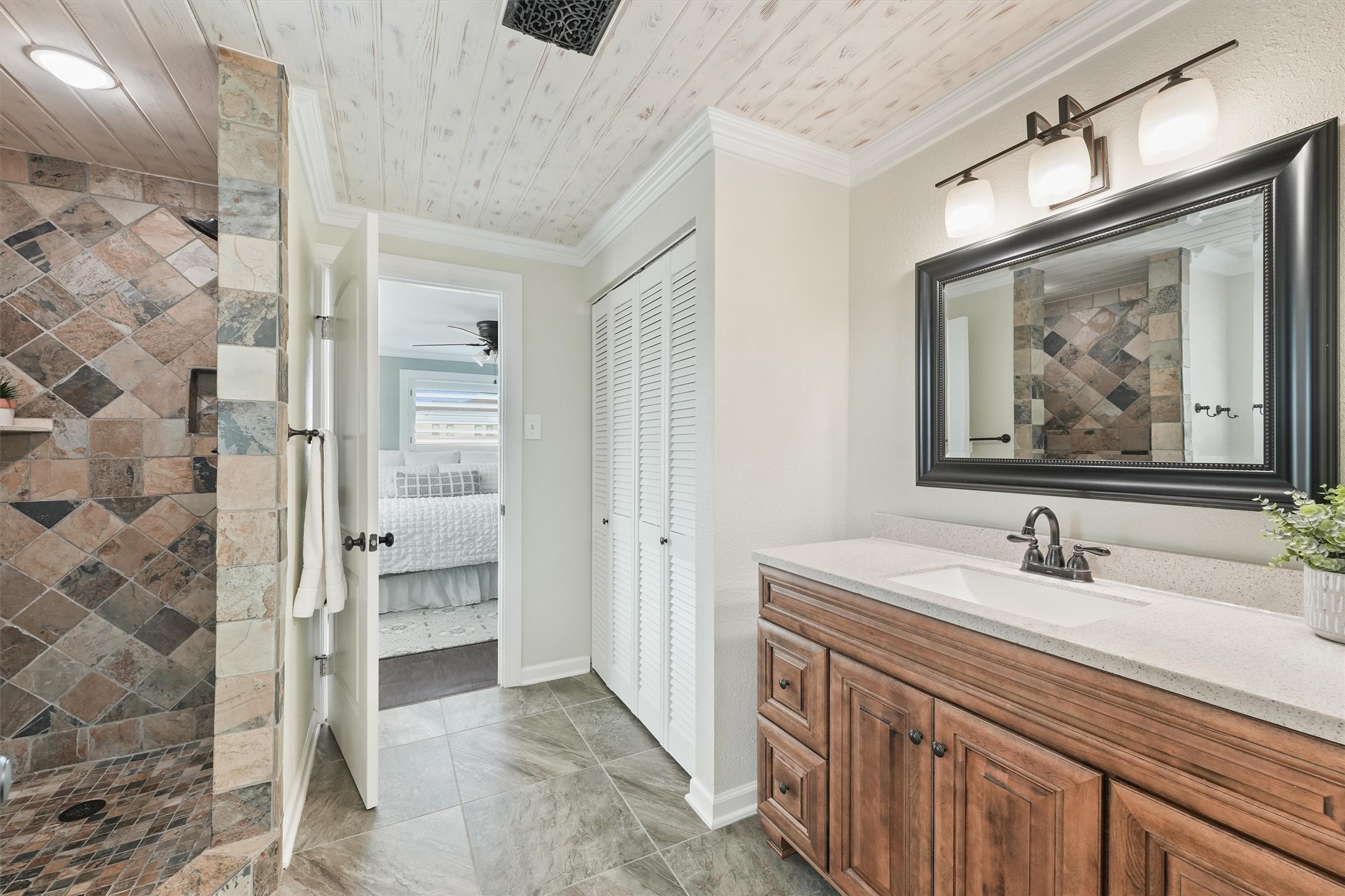 16634 Jamaica Beach Road Galveston, TX 77554 - Photo 19 of 47 a bathroom with a double vanity sink mirror and shower