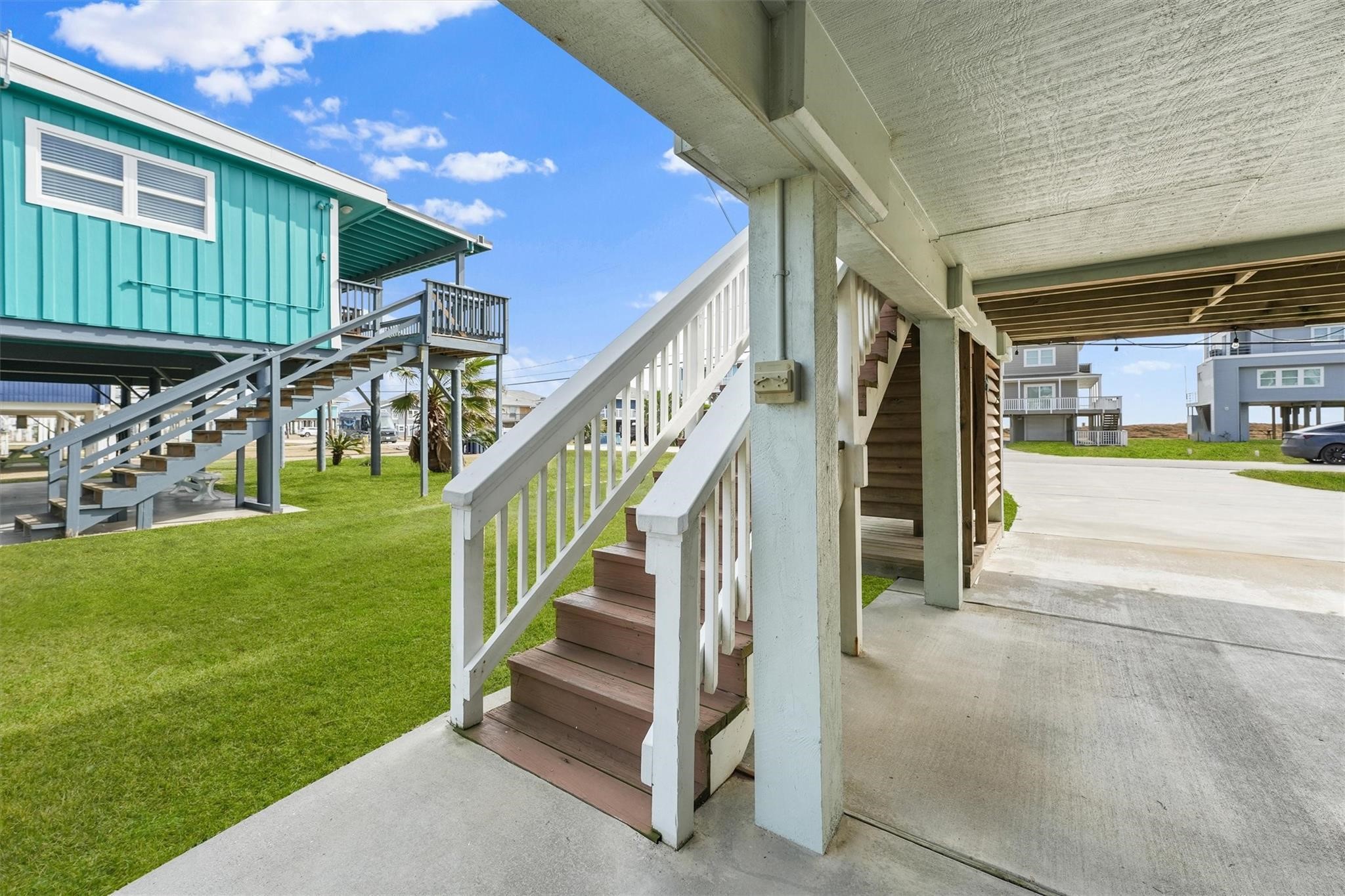 16634 Jamaica Beach Road Galveston, TX 77554 - Photo 27 of 47 a view of a house with a yard