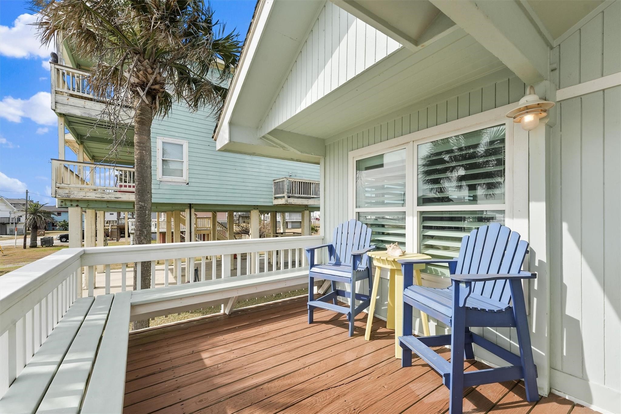 16634 Jamaica Beach Road Galveston, TX 77554 - Photo 32 of 47 a view of a chairs with a deck
