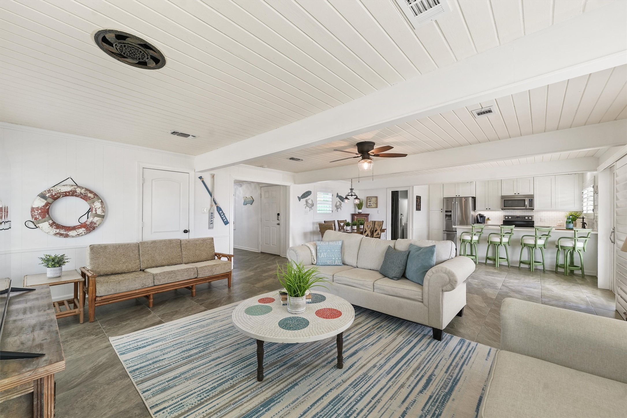 16634 Jamaica Beach Road Galveston, TX 77554 - Photo 6 of 47 a living room with furniture and a rug