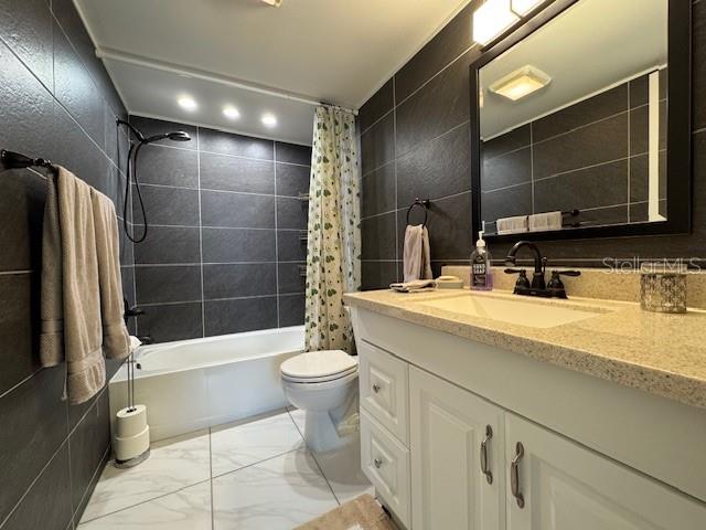 11485 Oakhurst Road, Unit 319 Largo, FL 33774 - Photo 4 of 63 a bathroom with a sink a toilet and shower