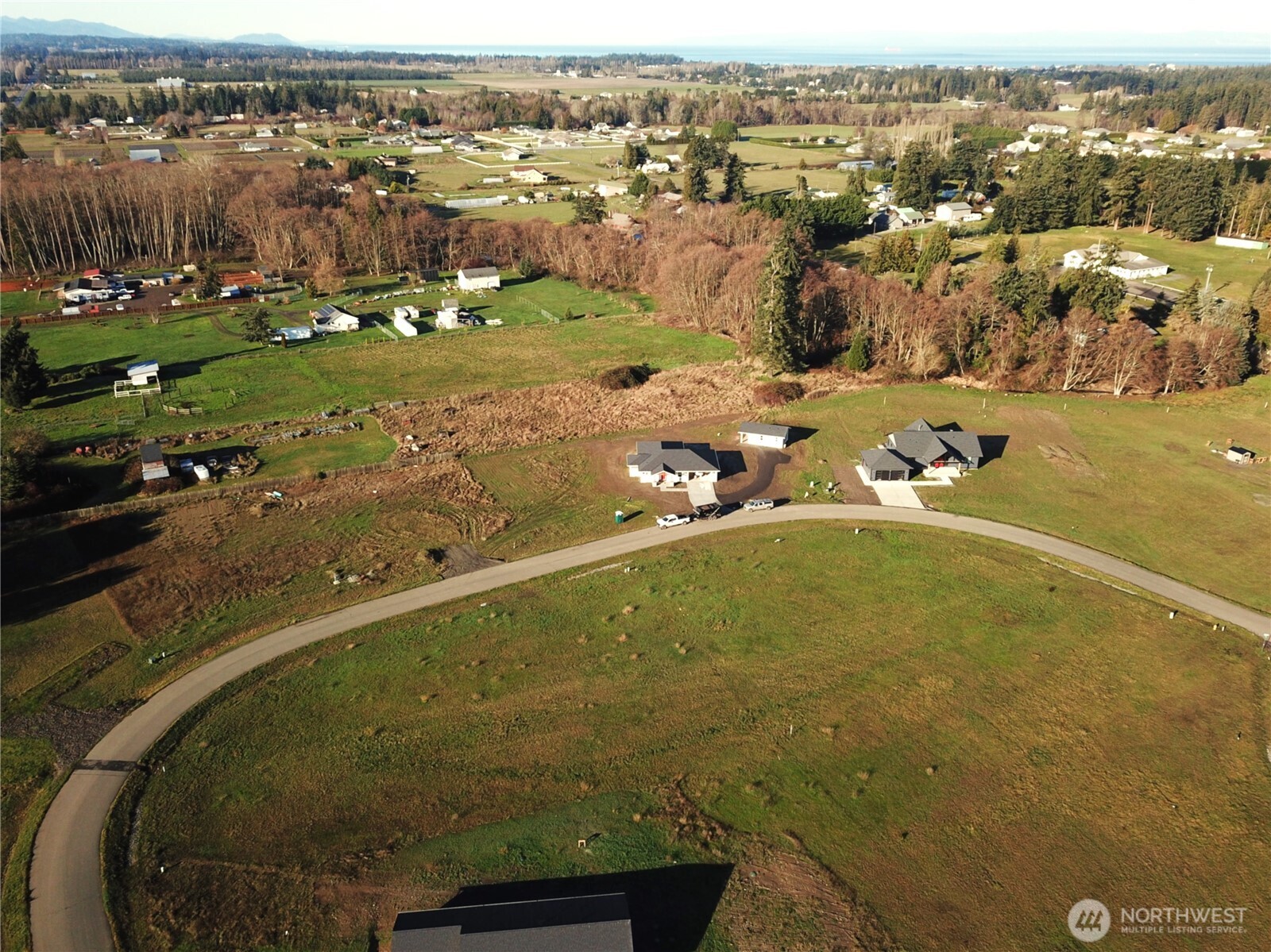 9999 Lange Lane Sequim, WA 98382 - Photo 7 of 16 an aerial view of residential houses with outdoor space