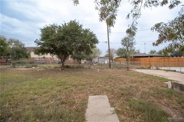 a view of outdoor space with garden and trees
