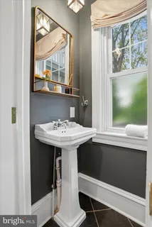 a kitchen with stainless steel appliances a stove a sink and a refrigerator