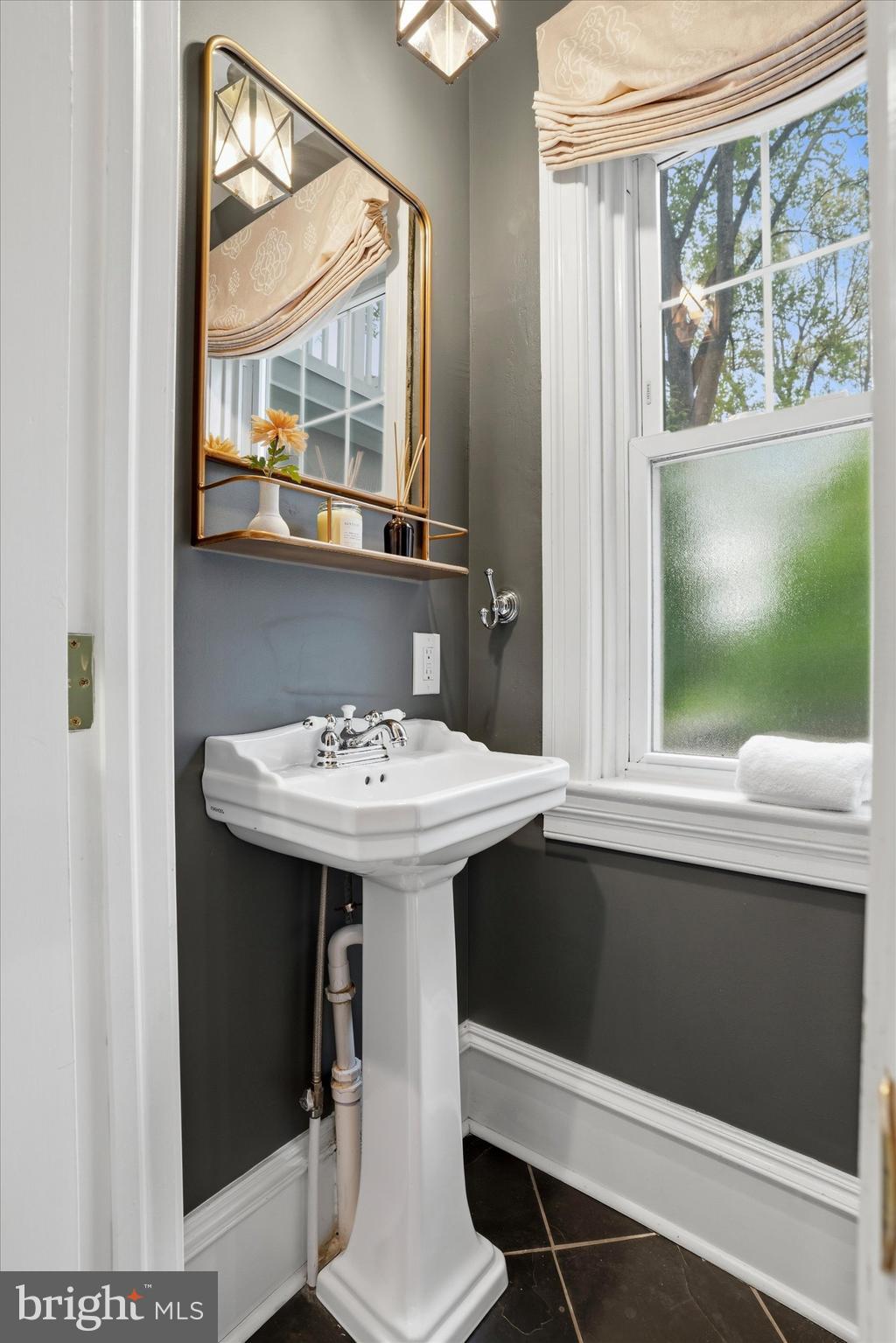 7 Farm Road Wayne, PA 19087 - Photo 19 of 65 a bathroom with a sink and a mirror