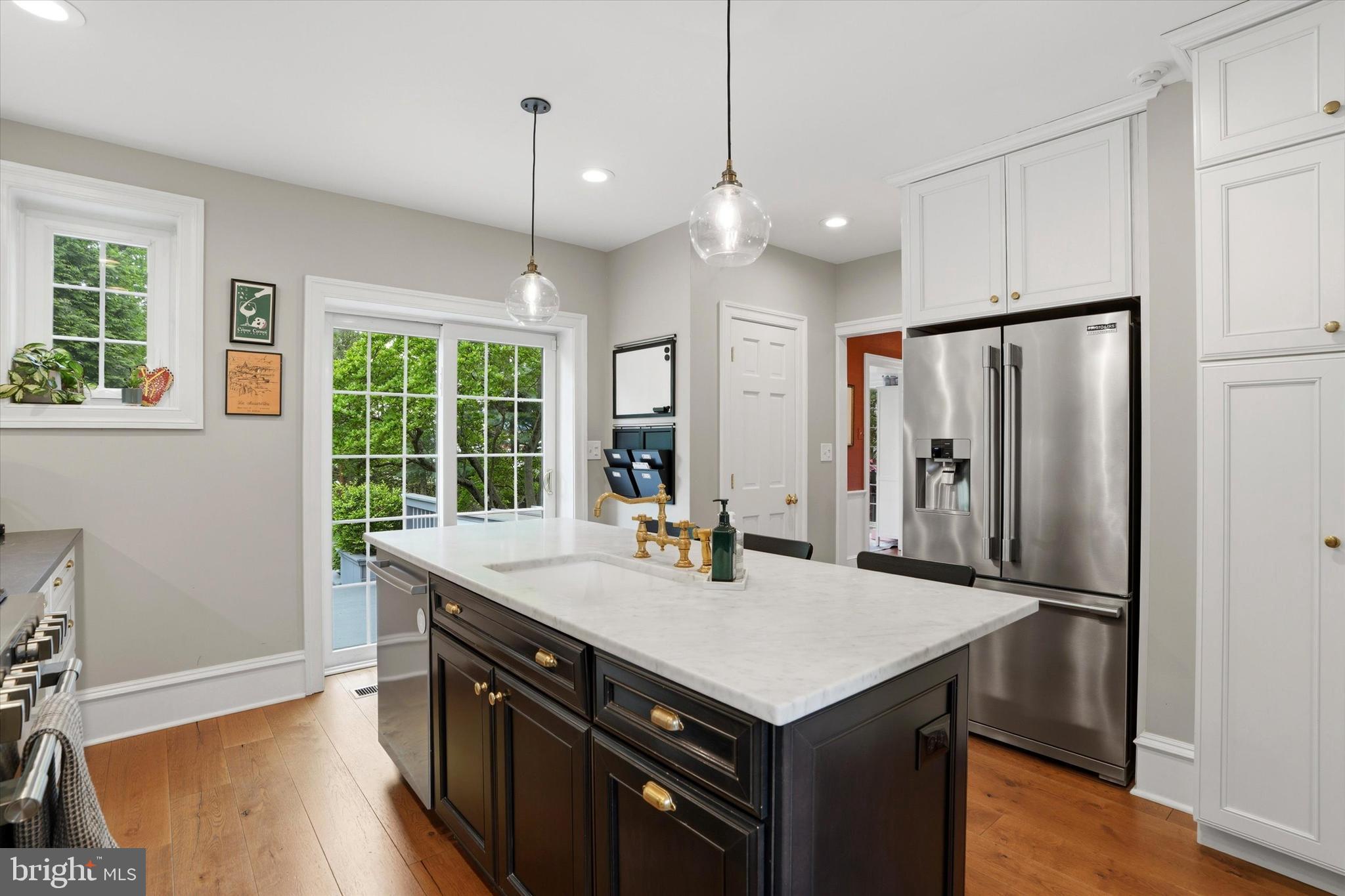 7 Farm Road Wayne, PA 19087 - Photo 23 of 65 a kitchen with kitchen island a sink appliances and a counter top space