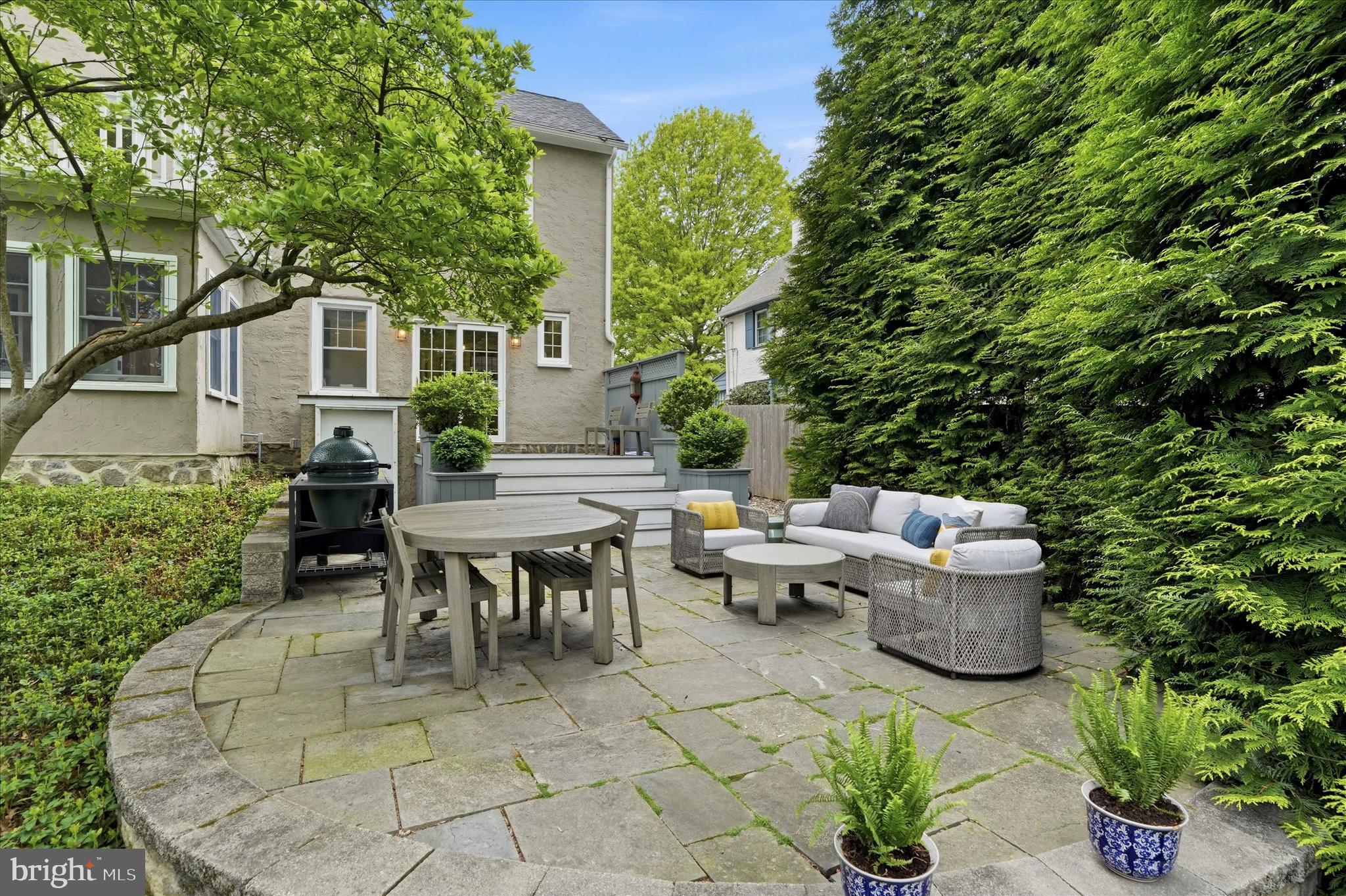 7 Farm Road Wayne, PA 19087 - Photo 45 of 65 a backyard of a house with table and chairs