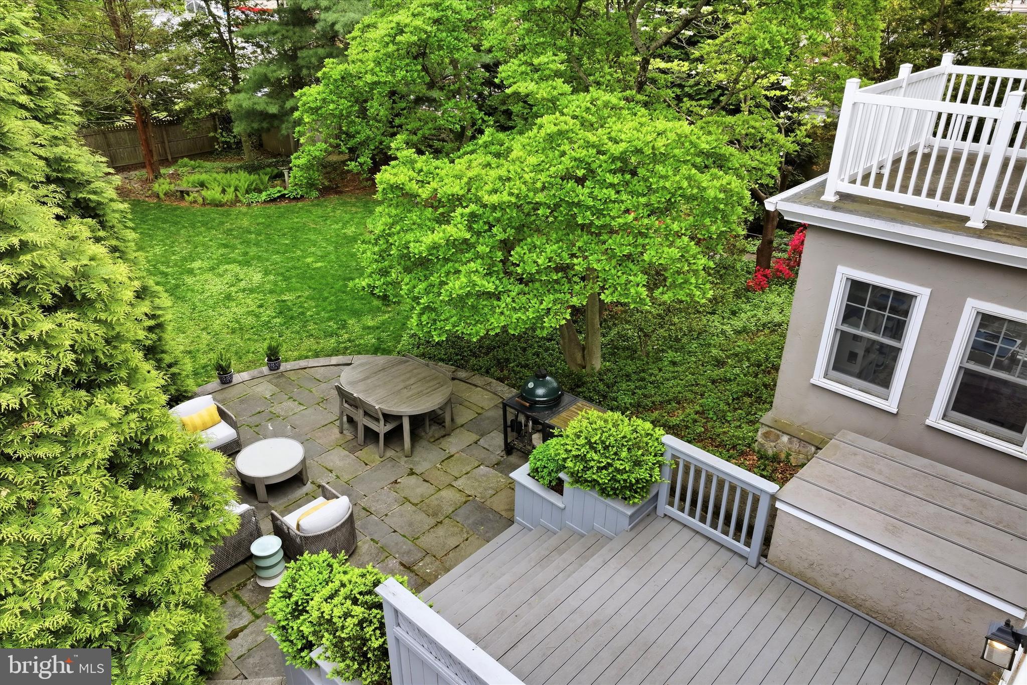 7 Farm Road Wayne, PA 19087 - Photo 57 of 65 a view of a table and chairs and potted plants
