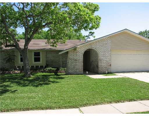 4822 Eider Drive Corpus Christi, TX 78413 - Photo 1 of 9 a front view of a house with a yard and garage