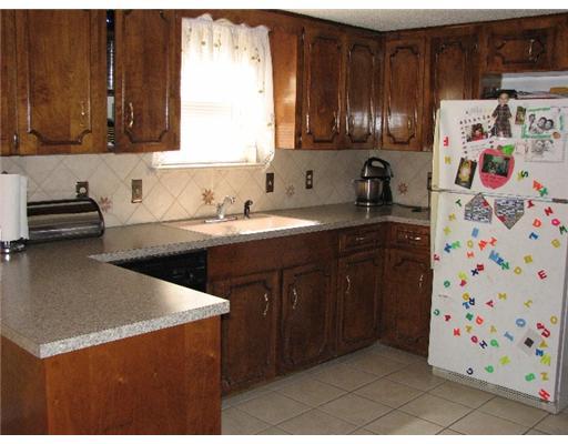 4822 Eider Drive Corpus Christi, TX 78413 - Photo 4 of 9 a kitchen with stainless steel appliances granite countertop a sink stove and refrigerator