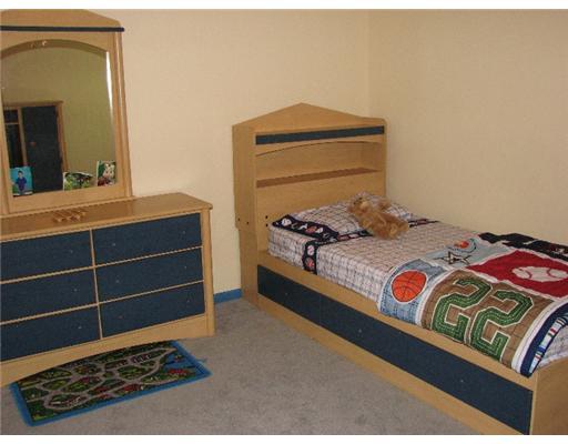 4822 Eider Drive Corpus Christi, TX 78413 - Photo 6 of 9 a bedroom with a bed and a dresser