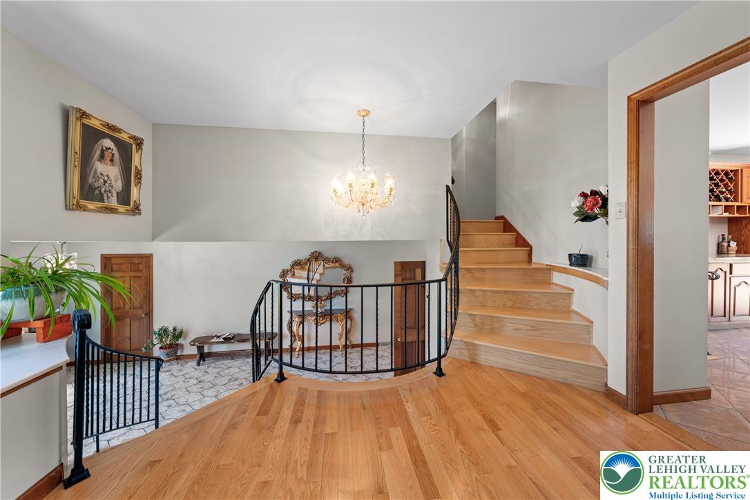 947 Tamenend Road Bath, PA 18014 - Photo 18 of 61 A sweeping hardwood staircase and decorative iron railing define this gracious entry foyer.