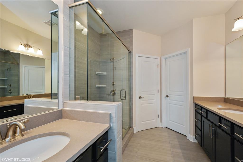 200 Braeden Way Alpharetta, GA 30009 - Photo 12 of 52 a bathroom with a sink and a mirror