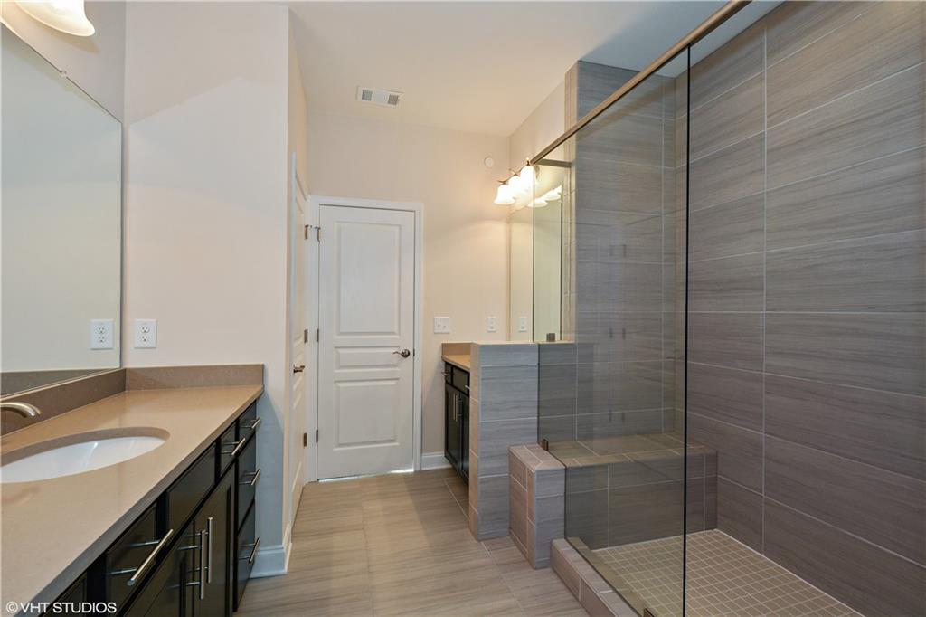 200 Braeden Way Alpharetta, GA 30009 - Photo 13 of 52 a bathroom with a sink and shower