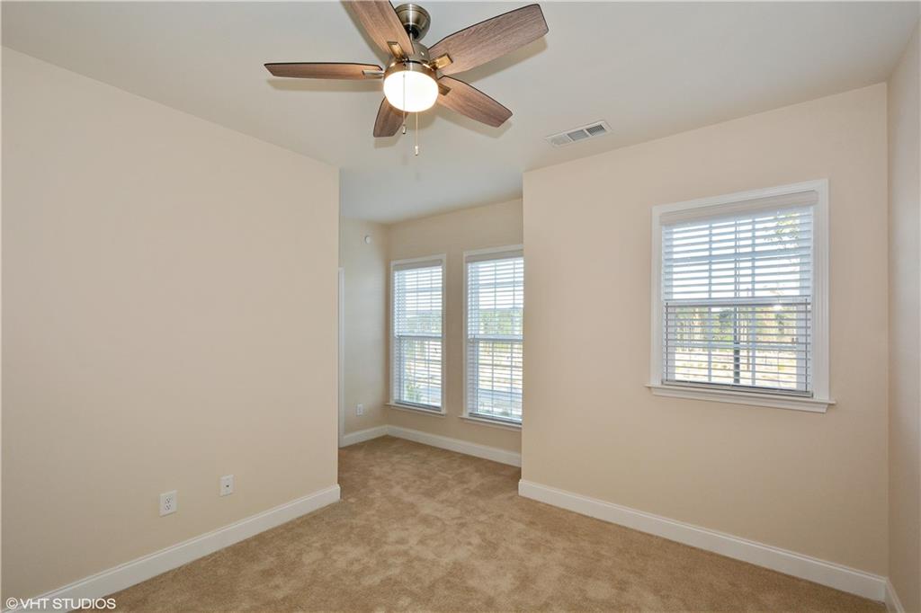 200 Braeden Way Alpharetta, GA 30009 - Photo 14 of 52 an empty room with fan and windows