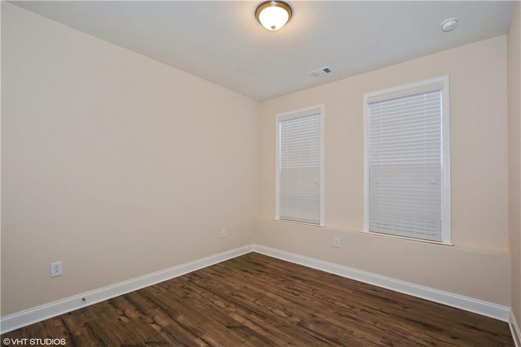 200 Braeden Way Alpharetta, GA 30009 - Photo 16 of 52 a view of an empty room with wooden floor and a window