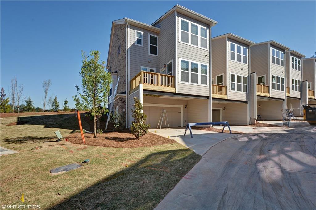 200 Braeden Way Alpharetta, GA 30009 - Photo 18 of 52 a view of a house with snow on the road