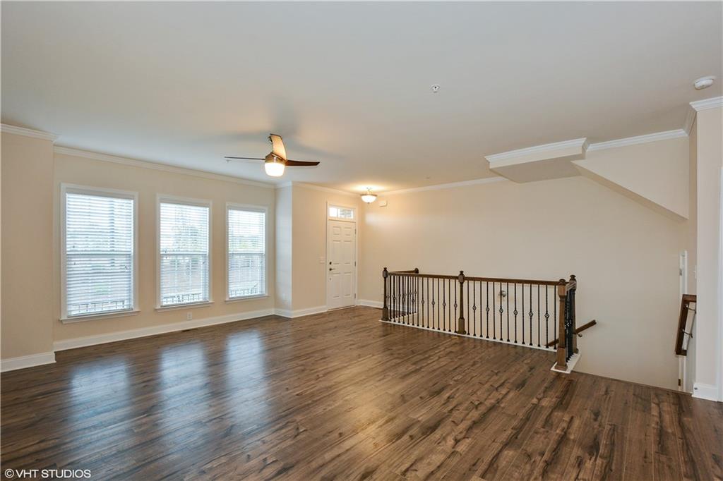 200 Braeden Way Alpharetta, GA 30009 - Photo 4 of 52 wooden floor in an empty room with a window