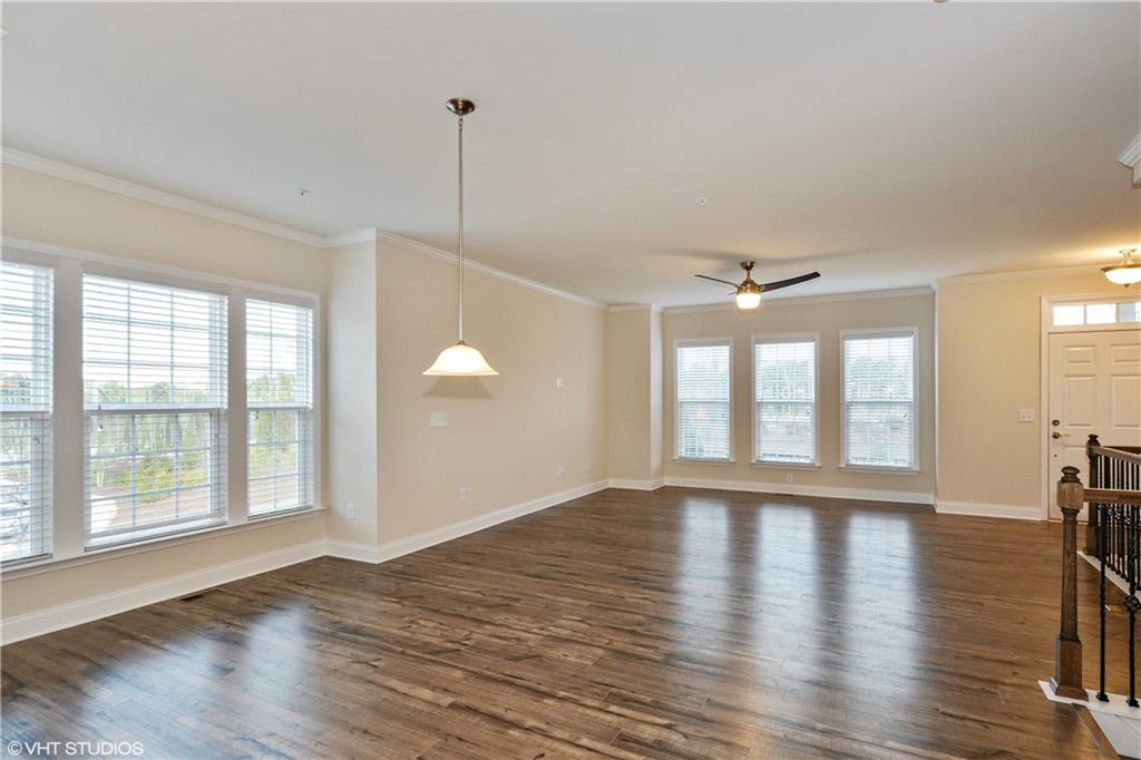 200 Braeden Way Alpharetta, GA 30009 - Photo 7 of 52 a view of an empty room with wooden floor and a window