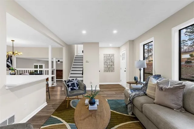 a bedroom with furniture and a wooden floor