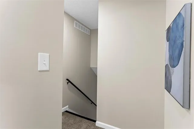 a bathroom with a sink mirror and toilet