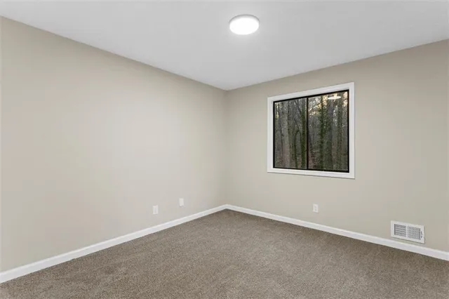 a view of a house with a yard and roof deck