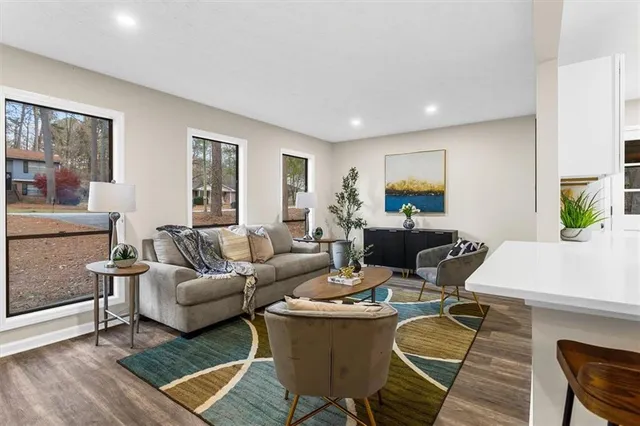 a living room with furniture and a large window