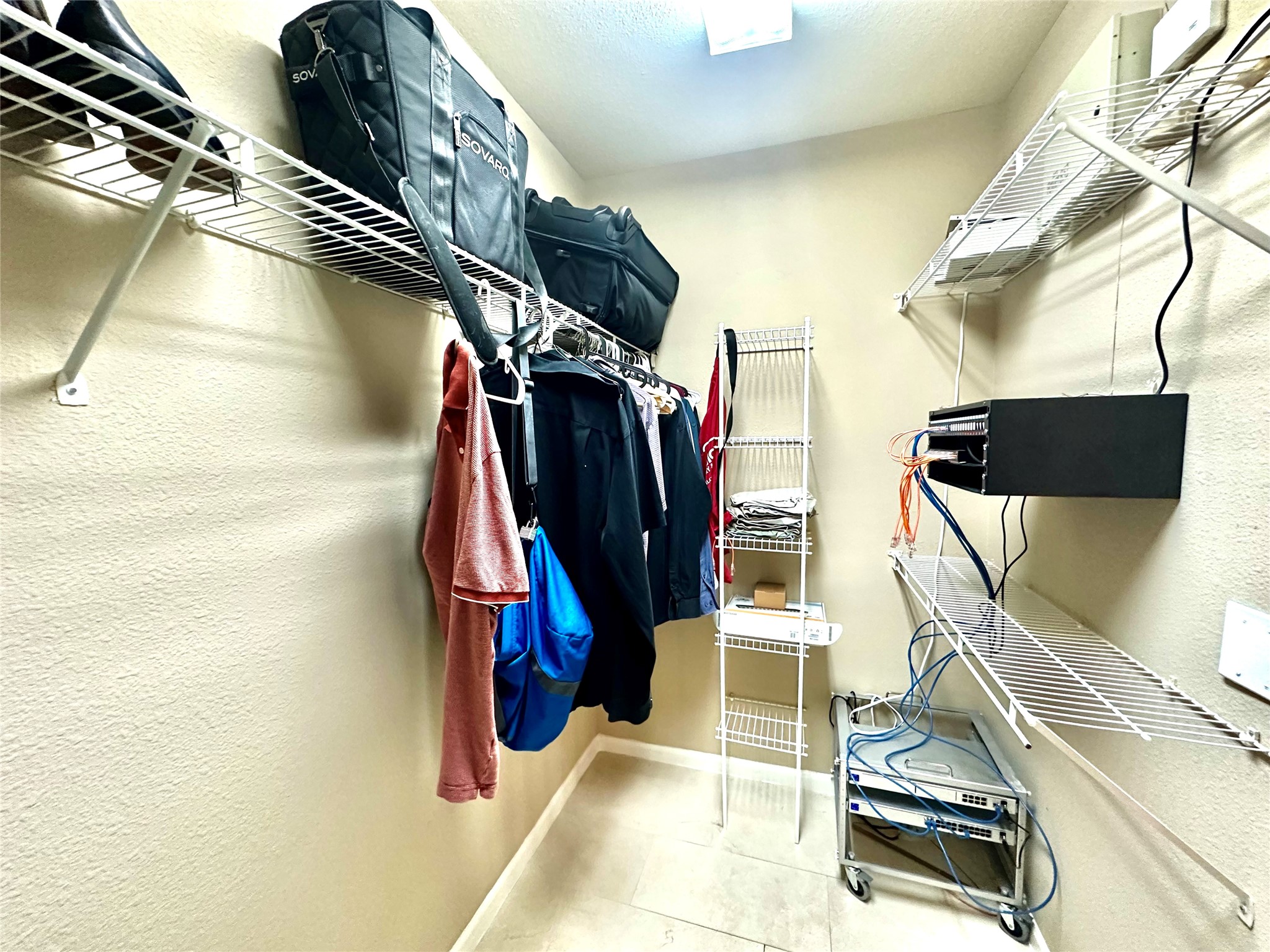 3505 Sage Road, Unit 406 Houston, TX 77056 - Photo 11 of 23 a view of walk in closet with clothes and shoes