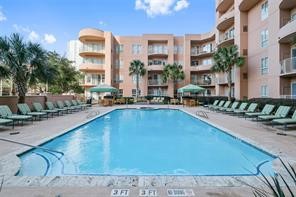 3505 Sage Road, Unit 406 Houston, TX 77056 - Photo 22 of 23 a swimming pool view with outdoor seating