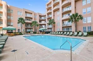 3505 Sage Road, Unit 406 Houston, TX 77056 - Photo 23 of 23 a swimming pool with outdoor seating and yard
