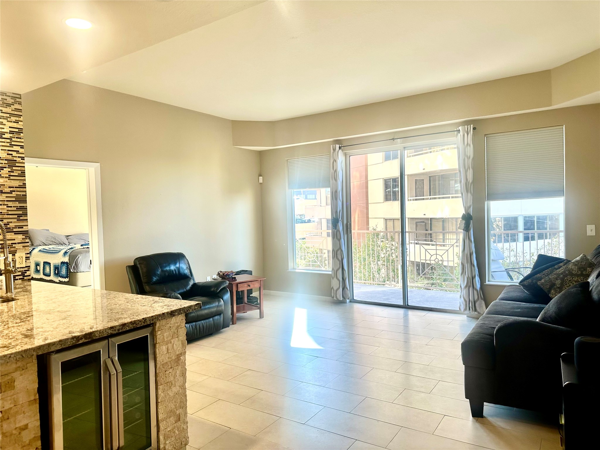 3505 Sage Road, Unit 406 Houston, TX 77056 - Photo 4 of 23 a living room with furniture and large windows