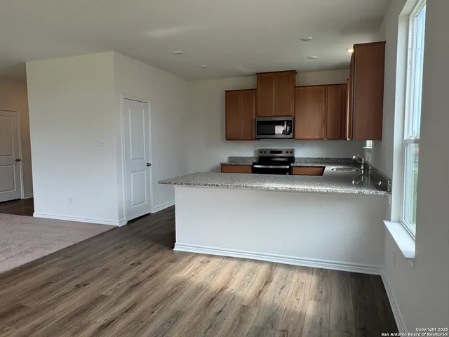 a view of kitchen with wooden floor