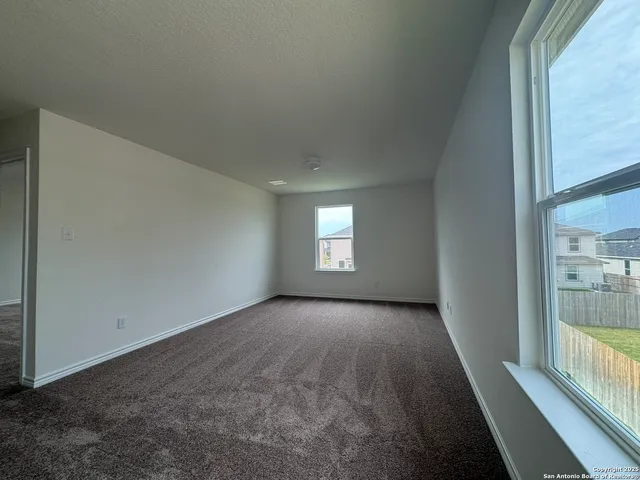 a view of a big room with windows