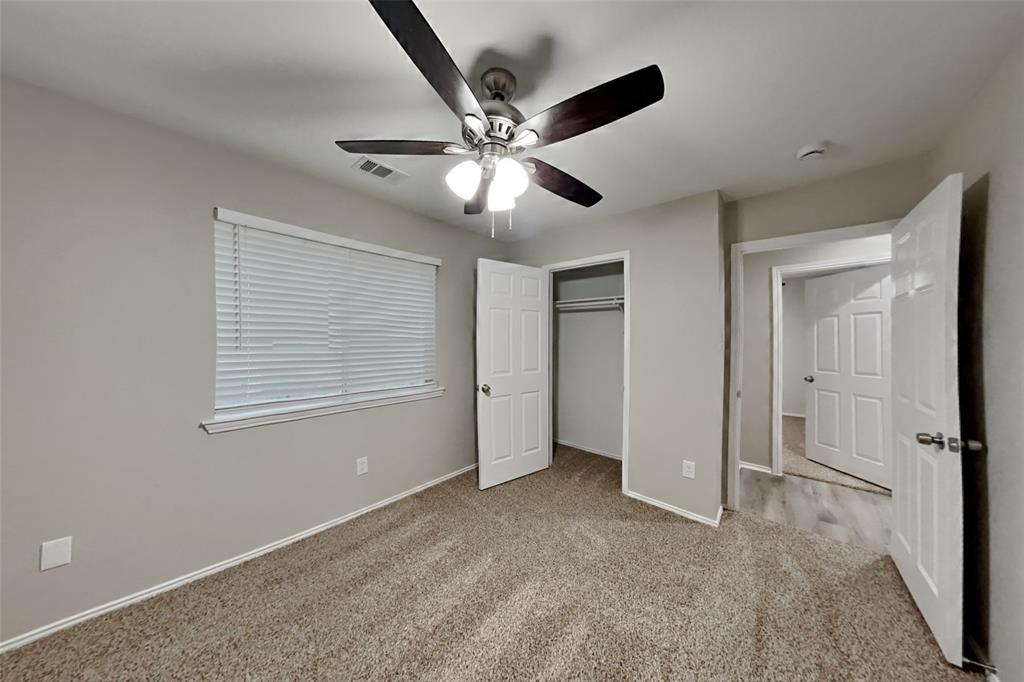817 Fox Hunt Trail Fort Worth, TX 76179 - Photo 13 of 17 Unfurnished bedroom with light colored carpet, ceiling fan, and a closet