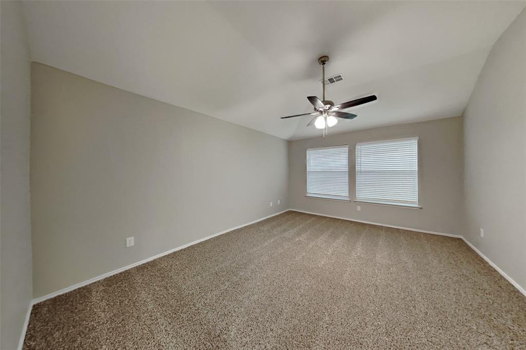 817 Fox Hunt Trail Fort Worth, TX 76179 - Photo 6 of 17 Empty room with carpet, lofted ceiling, and a ceiling fan