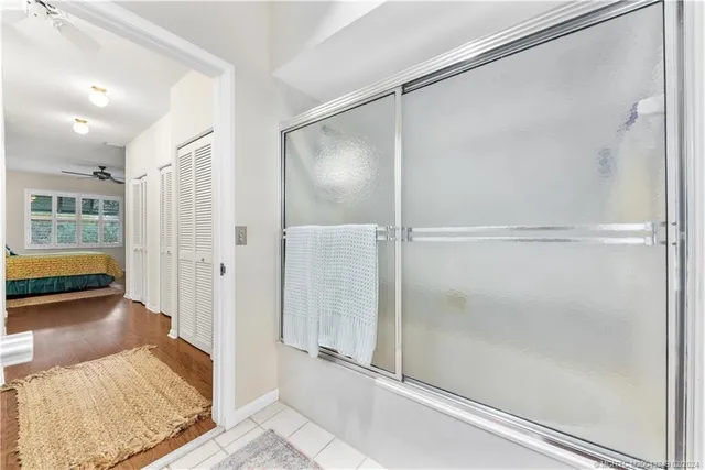 a walk in closet with a rug