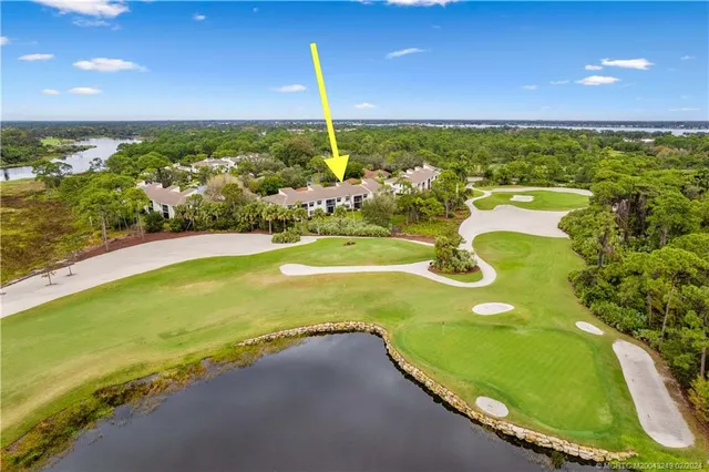 a view of an swimming pool with a yard