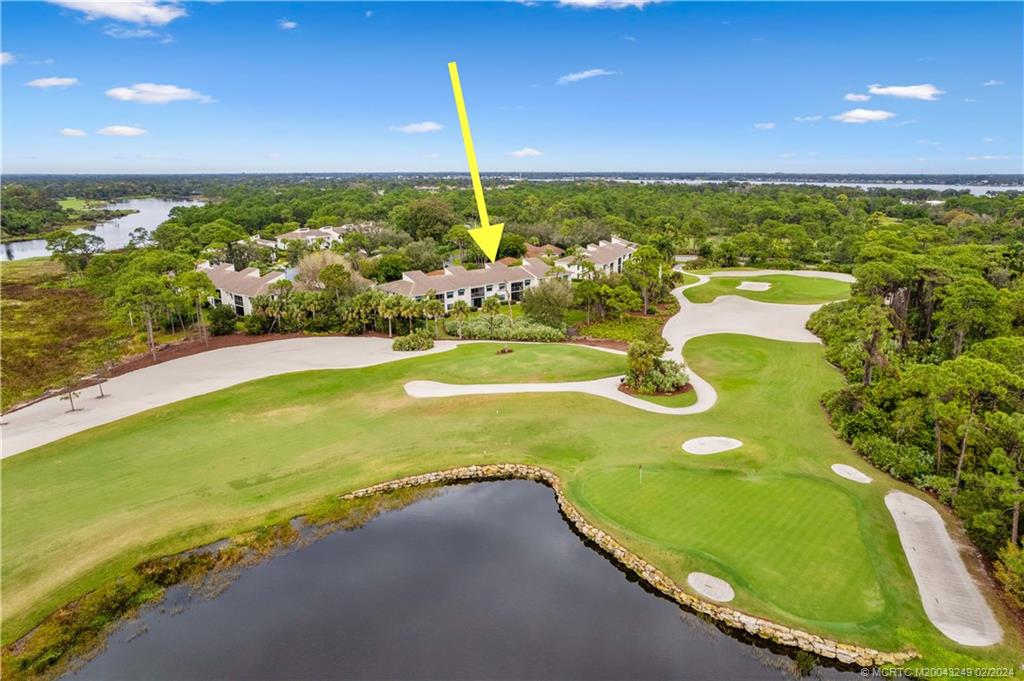 13424 Harbour Ridge Boulevard, Unit 4A Palm City, FL 34990 - Photo 31 of 33 a view of an swimming pool with a yard