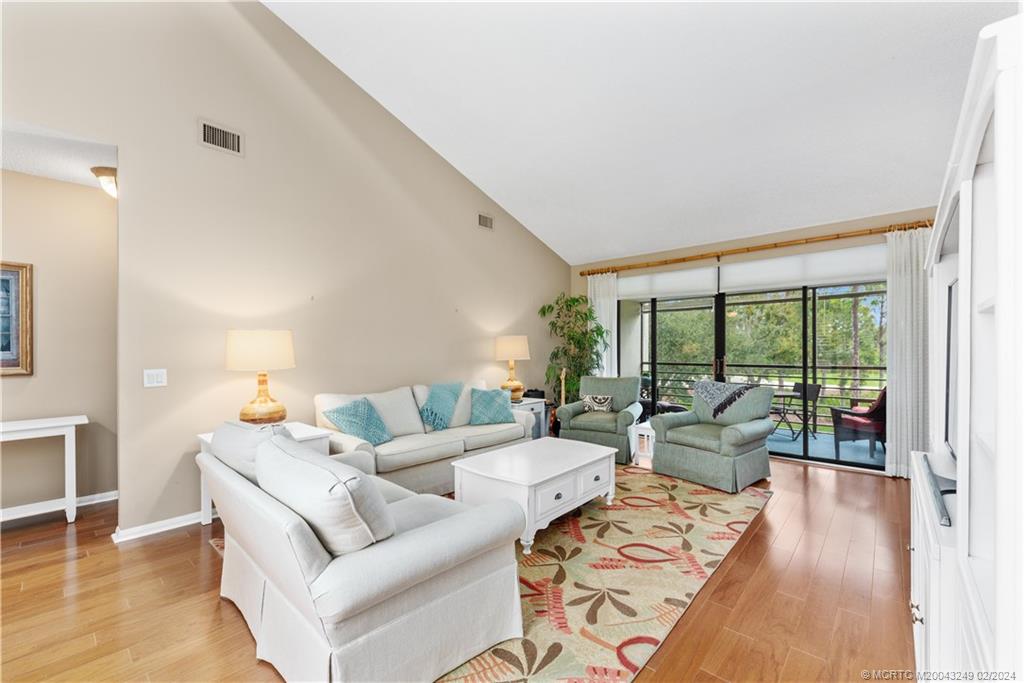13424 Harbour Ridge Boulevard, Unit 4A Palm City, FL 34990 - Photo 6 of 33 a living room with furniture and a large window