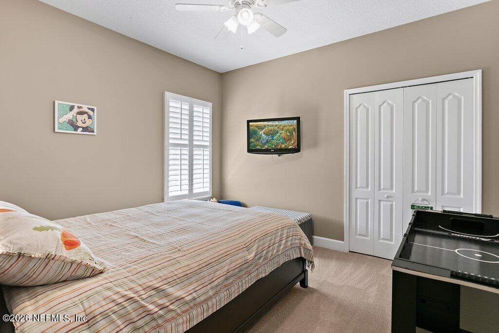 841 Ifield Road St. Augustine, FL 32095 - Photo 35 of 69 a bedroom with a bed and a window