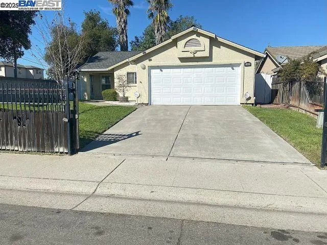 a view of front of house with a yard