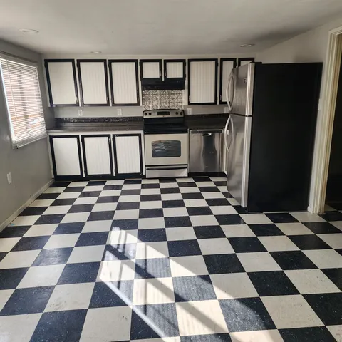 a black and white checkered floor with a black white checkered floor