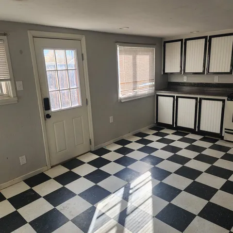 a black and white checkered floor with a black white checkered floor