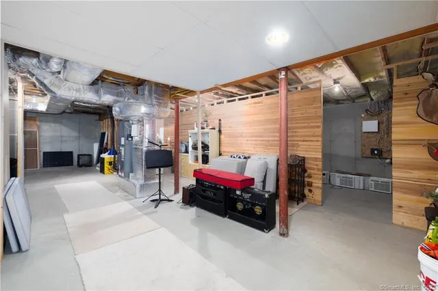 a bedroom with furniture and a chandelier